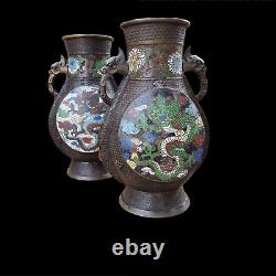 A good looking large pair of Chinese bronze vases. Champlevé or cloisonné