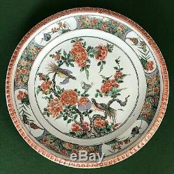 A large Chinese Kangxi Period (1662-1722) Famille-Verte'pie-crust' rim charger