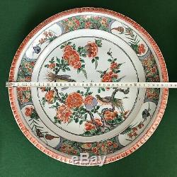 A large Chinese Kangxi Period (1662-1722) Famille-Verte'pie-crust' rim charger