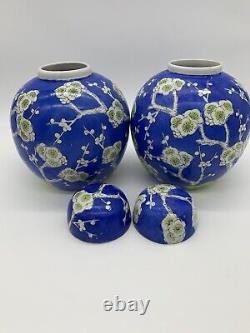 A large pair of Antique Chinese blue ground blossom ginger jars