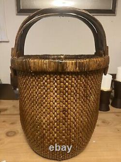 Large Antique Chinese woven rice basket with bent bamboo handle