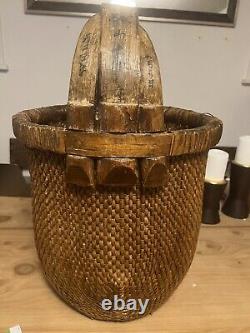 Large Antique Chinese woven rice basket with bent bamboo handle