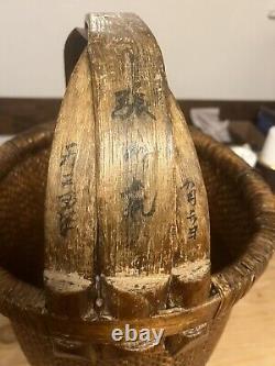 Large Antique Chinese woven rice basket with bent bamboo handle