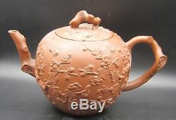 Large Yixing teapot with applied prunus ca 1700
