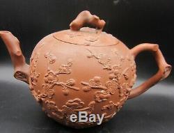 Large Yixing teapot with applied prunus ca 1700