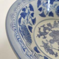 Bol en porcelaine chinoise ancienne bleue et blanche avec motif de fleurs
