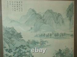 Estampe d'un grand lettré chinois ou japonais antique montrant une rivière, avec une signature.